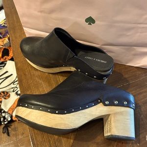 Women’s size 11 mule clogs. Black leather. Wooden block heel.
